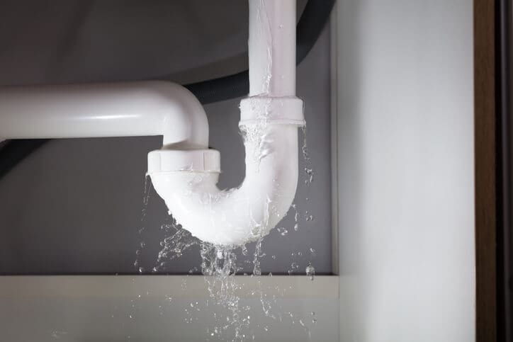 Leaking water pipe in bathroom Water Damage Restoration Services Arlington, WA